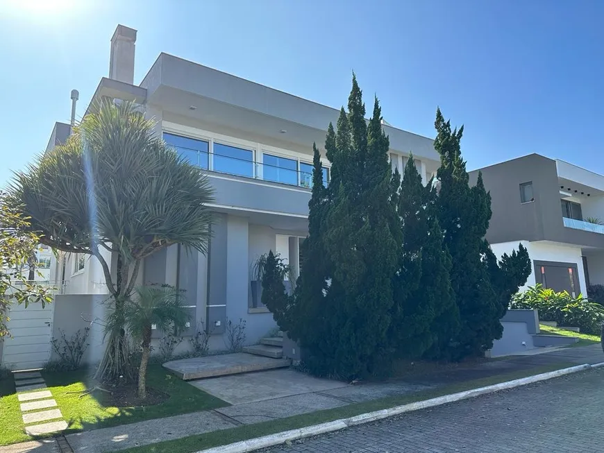 Foto 1 de Casa de Condomínio com 7 Quartos para venda ou aluguel, 900m² em Jurerê Internacional, Florianópolis