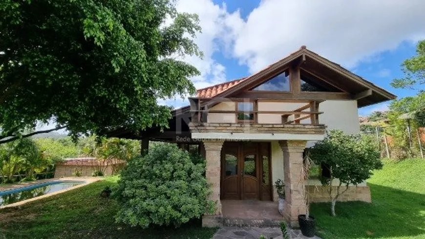 Foto 1 de Casa com 4 Quartos para alugar, 600m² em Vila Nova, Porto Alegre