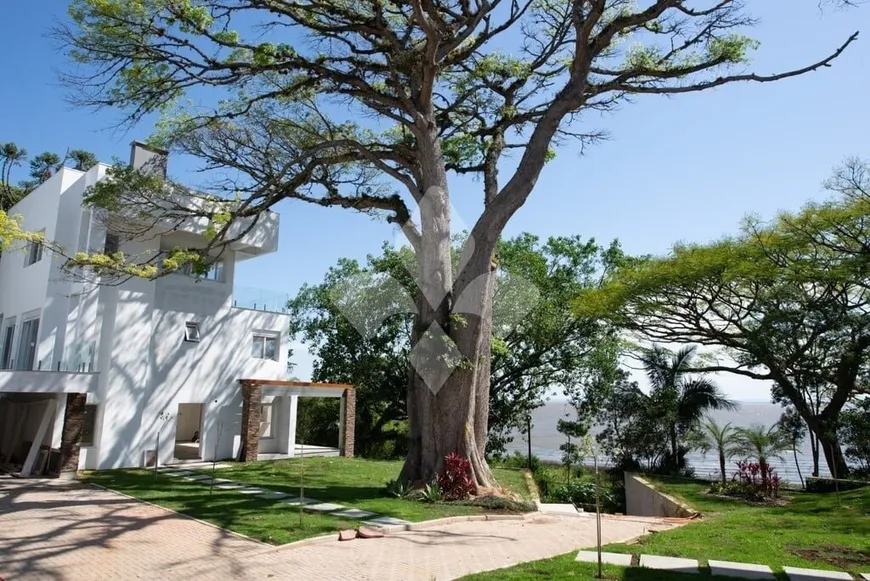 Foto 1 de Casa de Condomínio com 3 Quartos para alugar, 364m² em Pedra Redonda, Porto Alegre