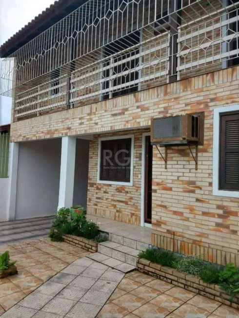 Foto 1 de Casa com 4 Quartos à venda, 320m² em Vila Nova, Porto Alegre