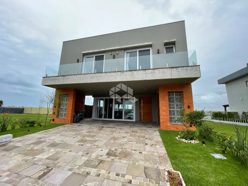 Foto 1 de Casa de Condomínio com 4 Quartos à venda, 250m² em Centro, Xangri-lá