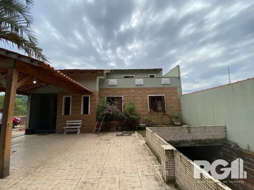 Foto 1 de Casa com 3 Quartos à venda, 883m² em Campo Novo, Porto Alegre