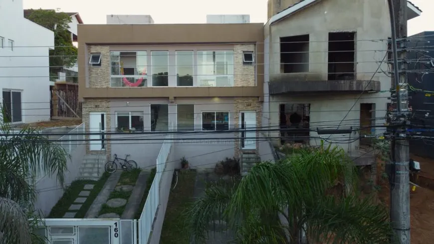 Foto 1 de Casa de Condomínio com 3 Quartos à venda, 110m² em Mário Quintana, Porto Alegre