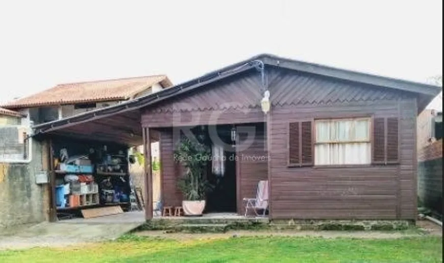 Foto 1 de Casa com 2 Quartos à venda, 51m² em Vila Nova, Porto Alegre