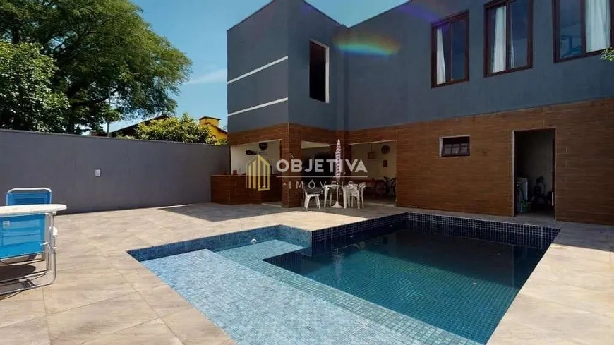 Foto 1 de Casa com 4 Quartos à venda, 240m² em Guarujá, Porto Alegre