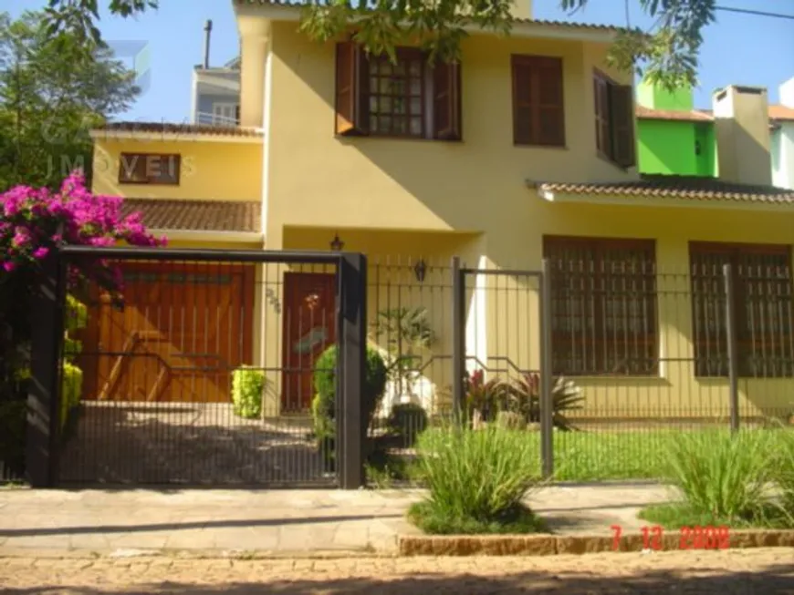 Foto 1 de Casa com 4 Quartos à venda, 243m² em Santa Fé, Porto Alegre