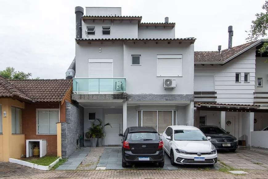 Foto 1 de Casa de Condomínio com 4 Quartos à venda, 165m² em Vila Nova, Porto Alegre