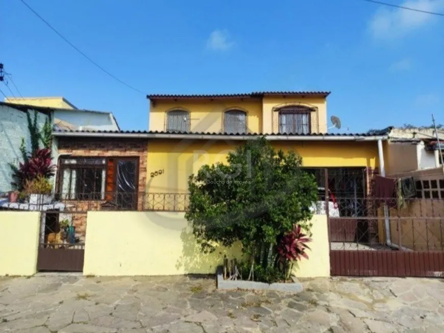 Foto 1 de Sobrado com 4 Quartos à venda, 99m² em Restinga, Porto Alegre