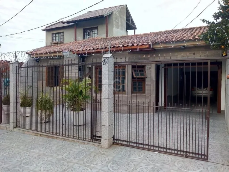 Foto 1 de Casa com 2 Quartos à venda, 139m² em Vila Nova, Porto Alegre