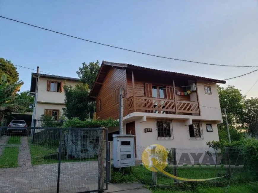 Foto 1 de Casa com 6 Quartos à venda, 300m² em Vila Nova, Porto Alegre