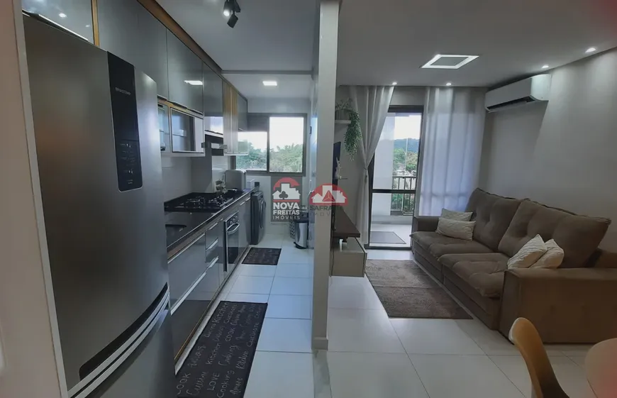 Foto 1 de Apartamento com 2 Quartos à venda, 58m² em Martim de Sa, Caraguatatuba